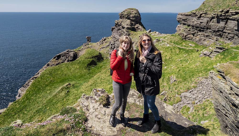 On the Go Tours South West Ireland Uncovered main two female travellers on Irish coast 808101688389085