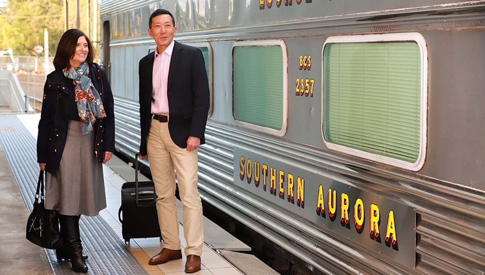 Vintage Rail Journeys Couple with Luggage