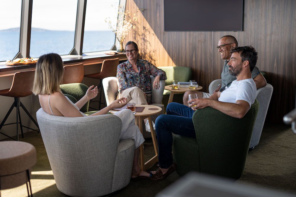 Luxury Lodges of Australia adds Tasmania's 'On Board' to collection 2 Guests relaxing in On Board's Odalisque's Wheelhouse Lounge & Bar