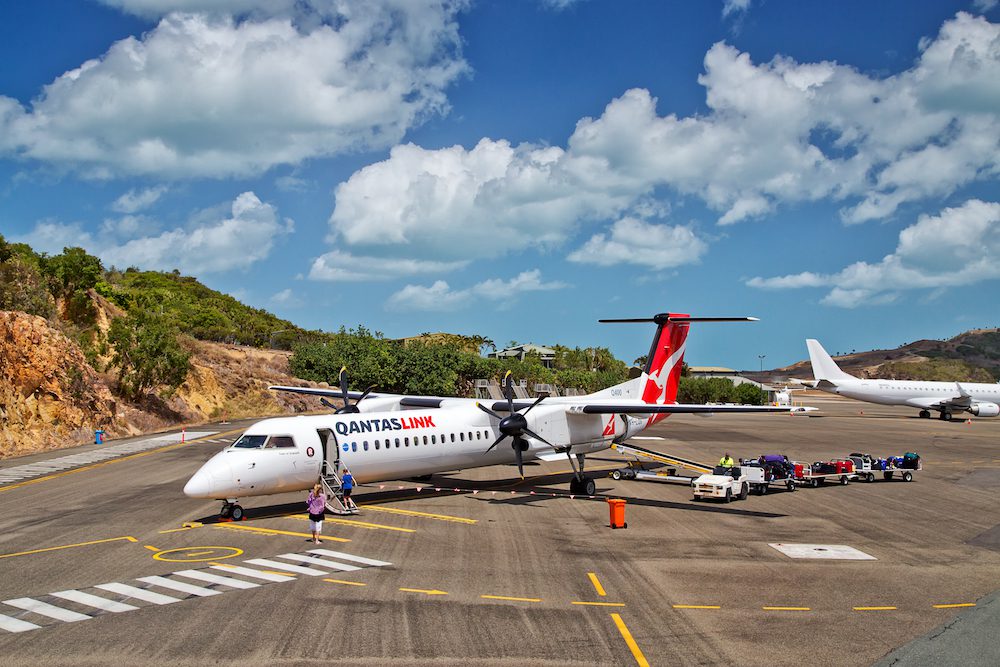 Passengers board a QantasLink aircraft in Hamilton Island. Qantas
