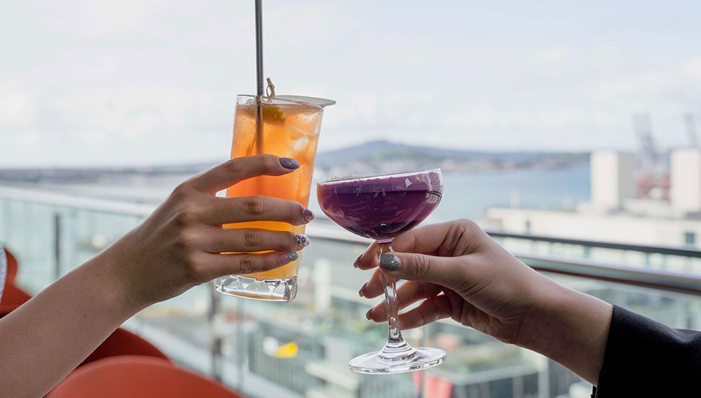 1000x568AirNZCocktails at Hi So harbour and Rangitoto background