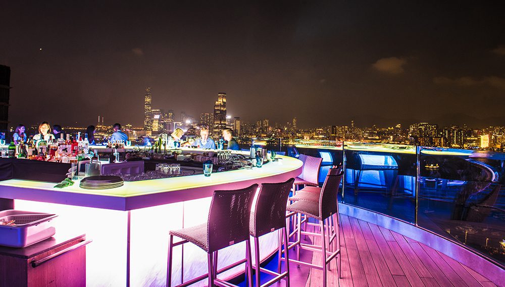 Sip cocktails as you admire Hong Kong's famous skyline from Skye Roofbar & Dining at The Park Lane Hong Kong, a Pullman Hotel, Causeway Bay