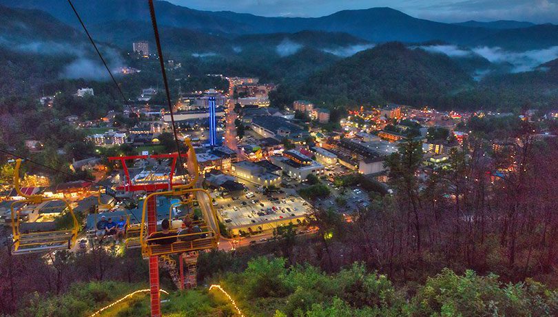 Night aerial view of Gatlinburg from Sky Lift with Sky Needle in the background