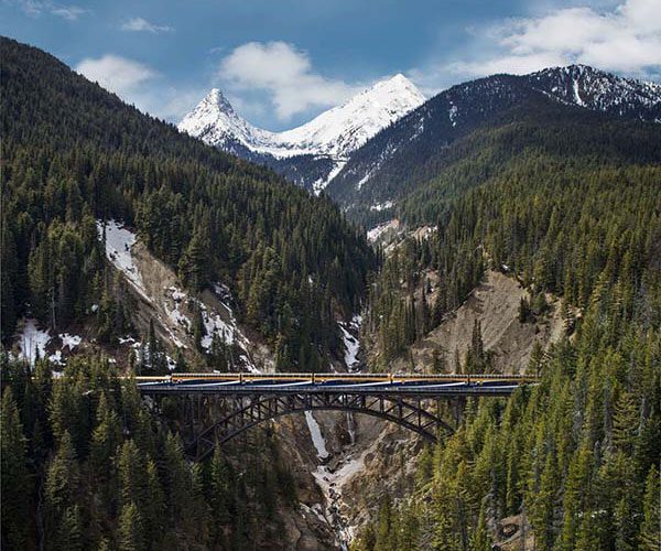 V2DBC Rocky Mountaineer train crossing a bridge over a ravine and river Rocky Mountaineer Noel Hendrickson