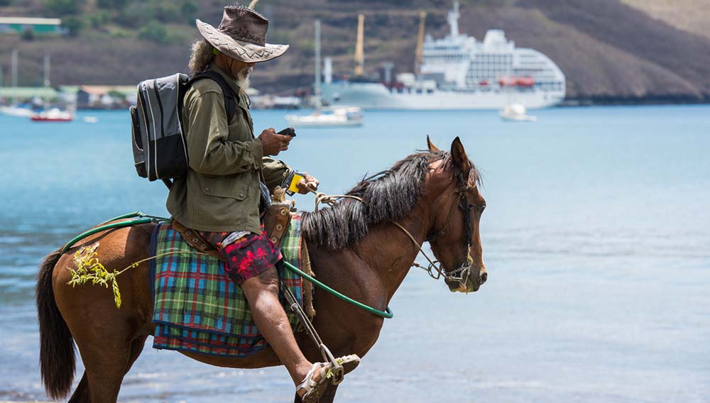 Global roaming: What’s hot in luxury expedition & soft adventure cruising 4 Aranui Marquesan locals greet Aranui 5 on horseback pls credit James Morgan
