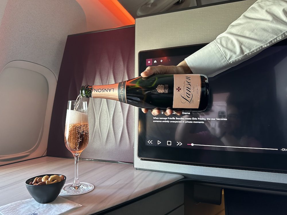 Lanson Champagne being poured in the Qsuite. Credit: Katrina Holden_Qatar Airways