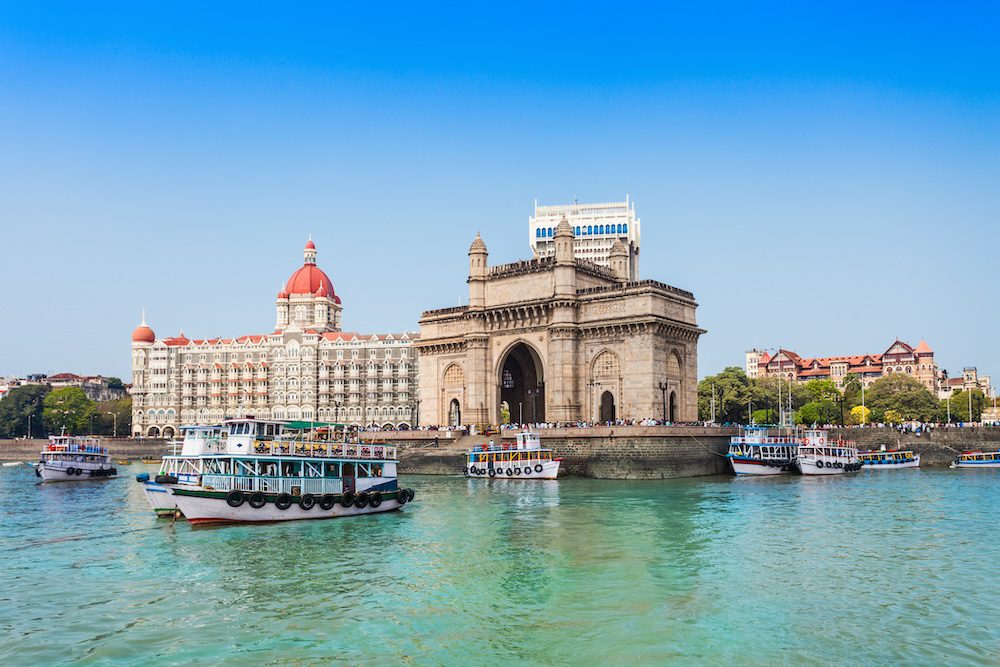 The Gateway of India and boats as seen from the Mumbai Harbour in Mumbai 
India travel