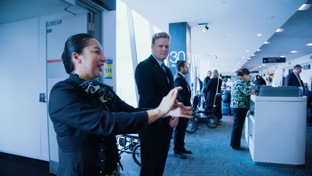 Air New Zealand flight attendant using NZ sign language. 