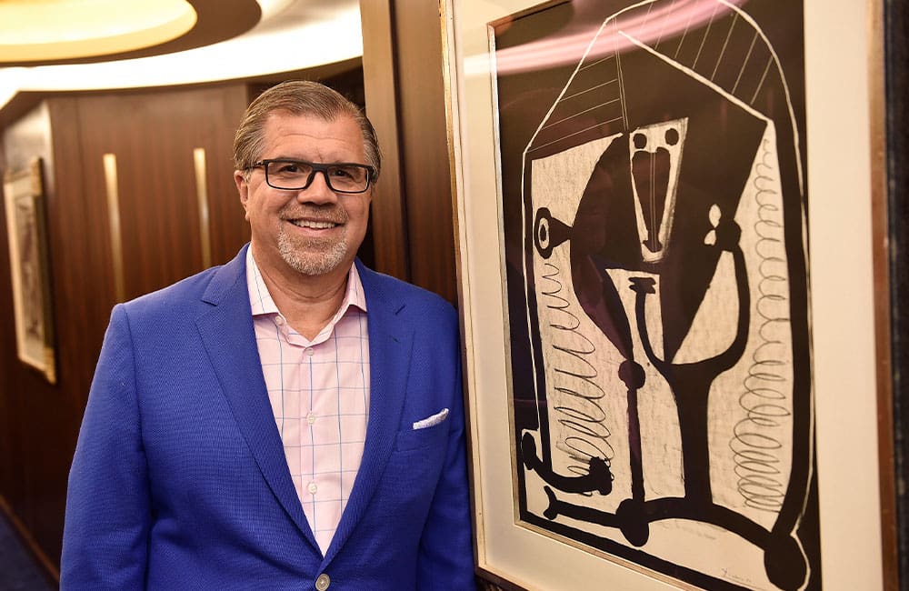 Floating galleries: the impressive art collections on luxury cruise ships 1 RSSC-Frank-Del-Rio-with-Picasso-lithographs-titled-Figure_1000x648