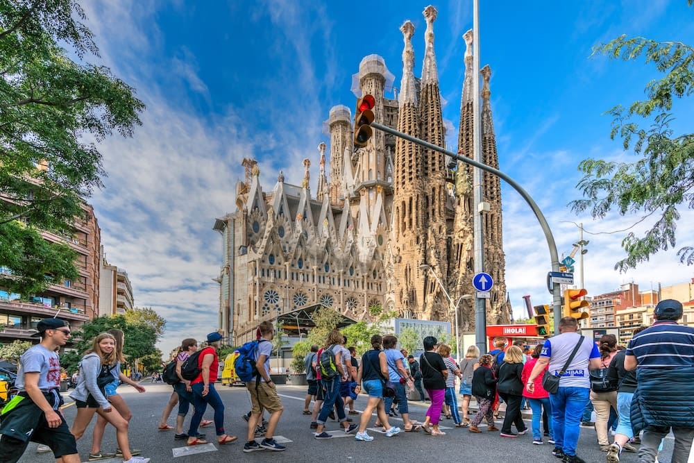Tourists visiting the Sagrada Familia basilica church.