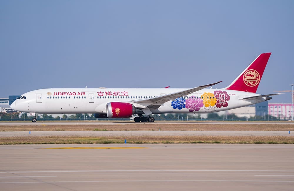 Juneyao Air Boeing 787-9 aircraft on tarmac.