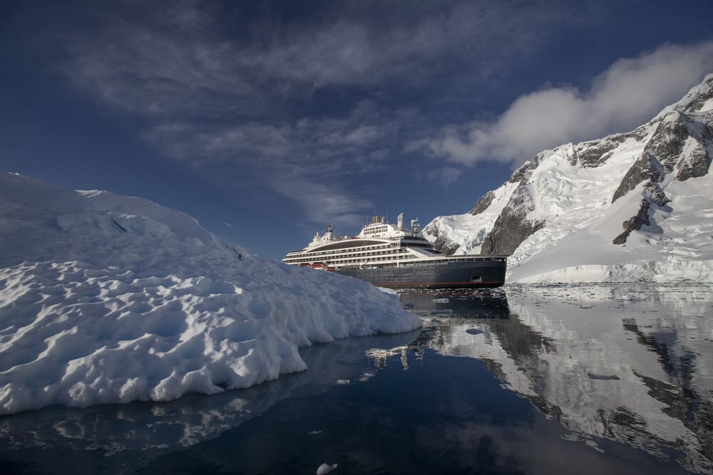 Ponant releases 2023 Sustainability Report, making progress towards net-zero emissions goal 2 Ross Sea trip on board Le Commandant Charcot. Ship with reflections at Port Charcot. © Sue Flood_Ponant
