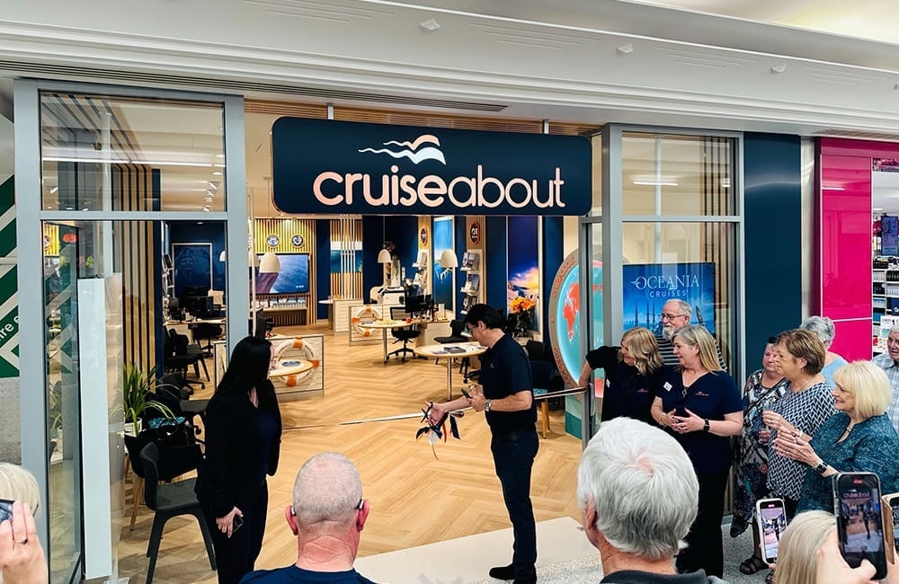 Ignite Travel Group CEO Ryan Thomas cuts the ribbon on the new Cruiseabout store at Westfield West Lakes, Adelaide.