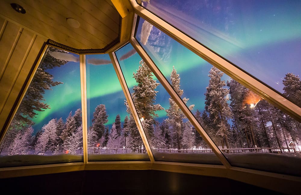 The Northern Lights as seen from inside a glass cabin on an Insights Vacation Scandinavia tour.