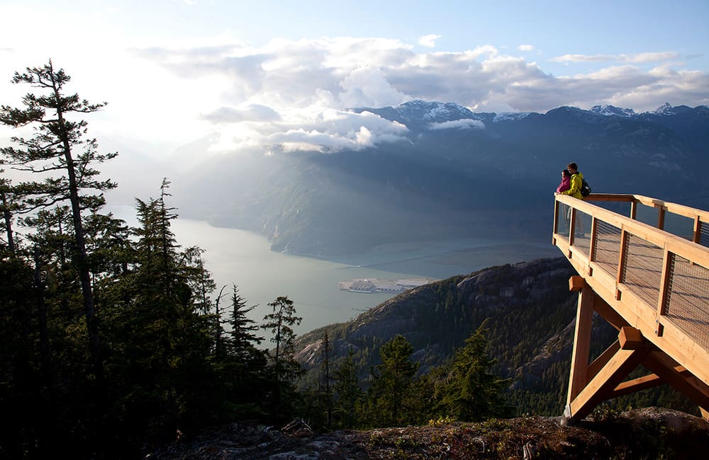 Couple looking at the view from a lookout at Sea to Sky Gondola. Image: Destination Vancouver/Sea to Sky Gondola/Paul Bride