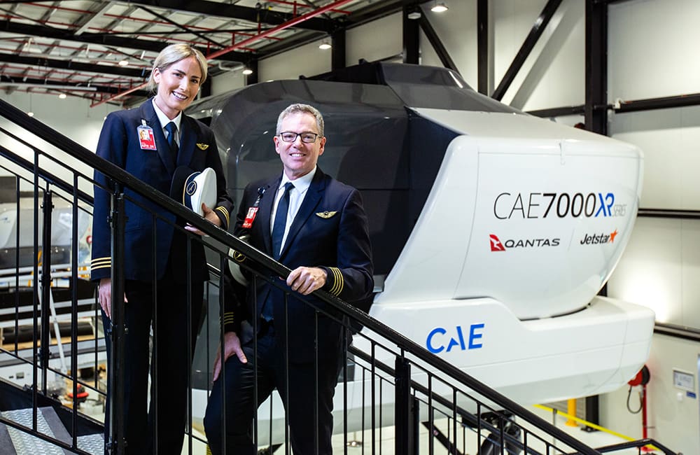 Qantas Group training officers outside the CAE 7000XR Series full-flight simulator at the new Sydney Flight Training Centre.