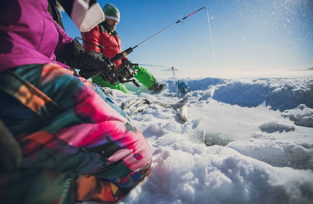 Close-up of people ice fishing in Ontario. Image: Goh Iramoto