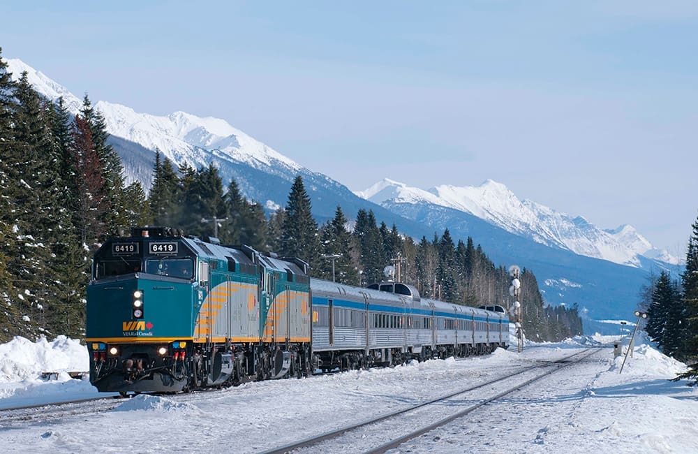 VIA Rail's The Canadian train in Canadian Rockies in winter.