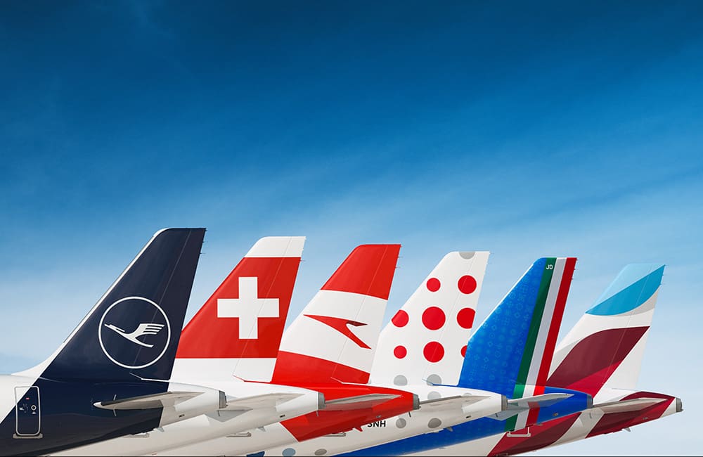 Stylised image of Lufthansa Group airline tails lined up, including ITA Airways.