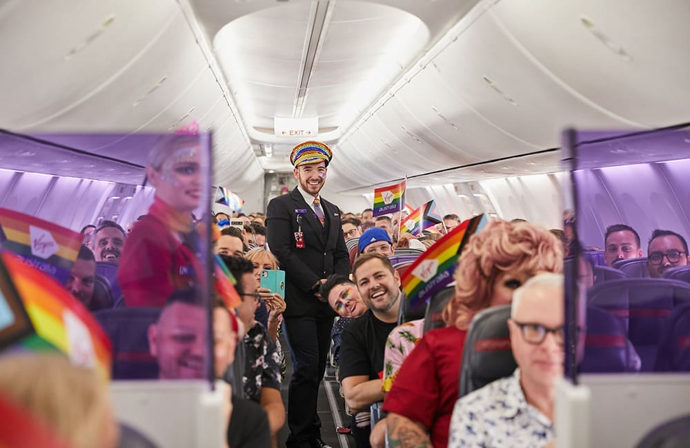 Flight attendant and passengers on Virgin Australia Pride Flights.