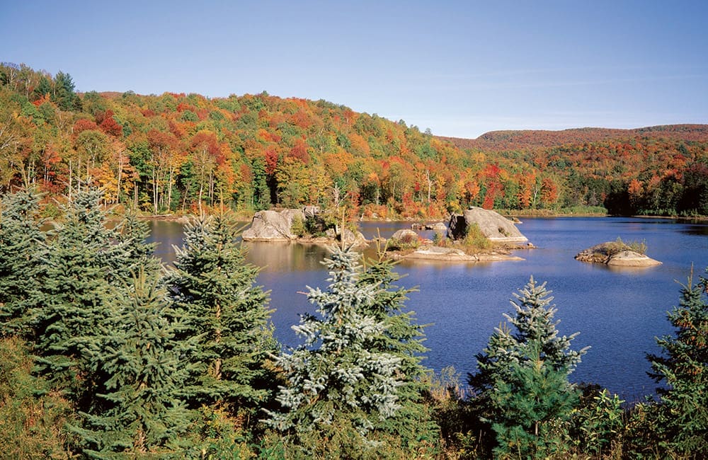 Lake and autumn landscape in Eastern Townships, Quebec.