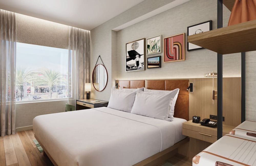 Render of a King guestroom at Pan Am Hotel by Hilton at Citadel Outlets.