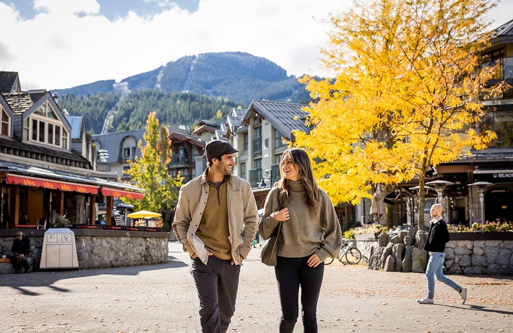 Couple walking in Downtown Whistler, British Columbia in auumn