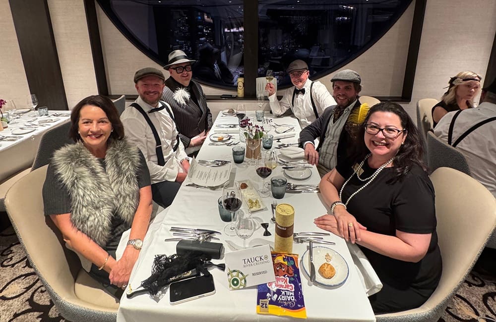 Tauck Director and Sales team dressed to impress for the Roaring '20s party aboard river cruise ship.