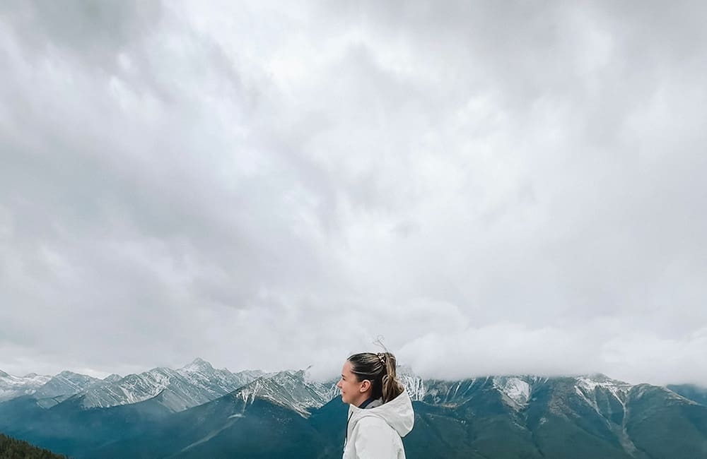 Josie Allen (Warranambool Travel) framed by Rocky Mountains.