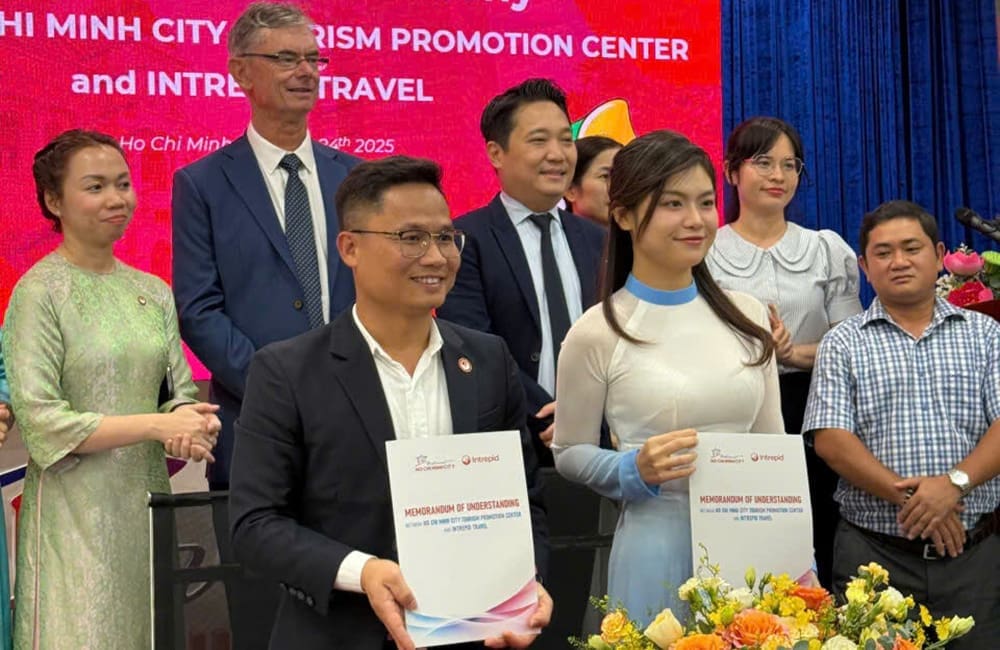 Intrepid Travel Co-Founder Geoff Manchester (back, second from left) with Vietnam GM Hanh Nguyen (front left) at the MOU signing ceremony in Ho Chi Minh City.