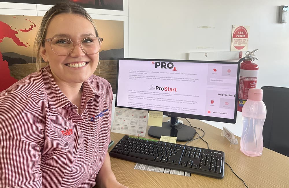 TC ProStart grad Montana Freeman from Travel & Cruise Ceduna in front of her computer.