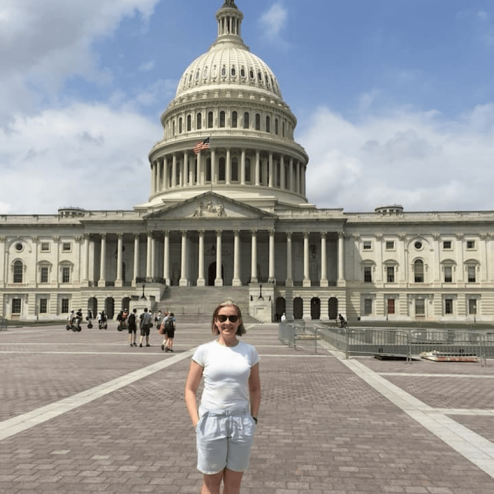 Liz Glover outside the U.S. Capitol. Her work in the travel industry is built on a belief in perspective and purpose, shaped by experiences across the world.