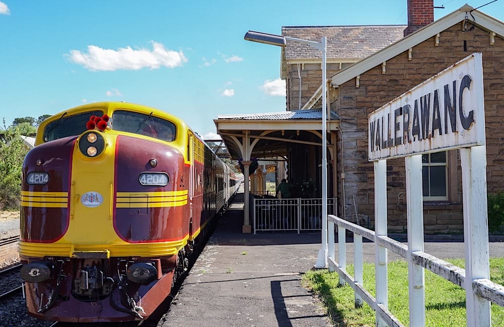 Historic stations and regional towns frame the route as fans roll towards the King’s festival.