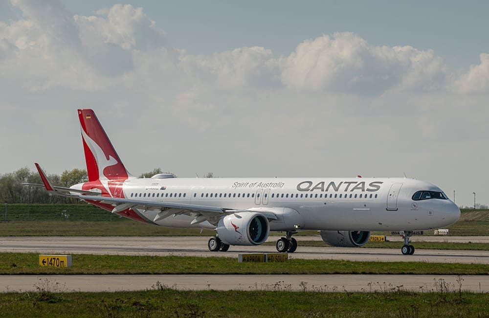 Qantas Airbus A321XLR aircraft named Great Ocean Road (VH-OGA) on the tarmac.