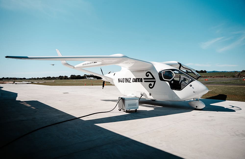 Air New Zealand's all-electric BETA ALIA CX300 aircraft charging at Tauranga Airport ahead of its test flight