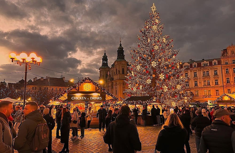 Prague Christmas Market in the Old Town Square at dusk. Image:  Emma-Marie Hughes