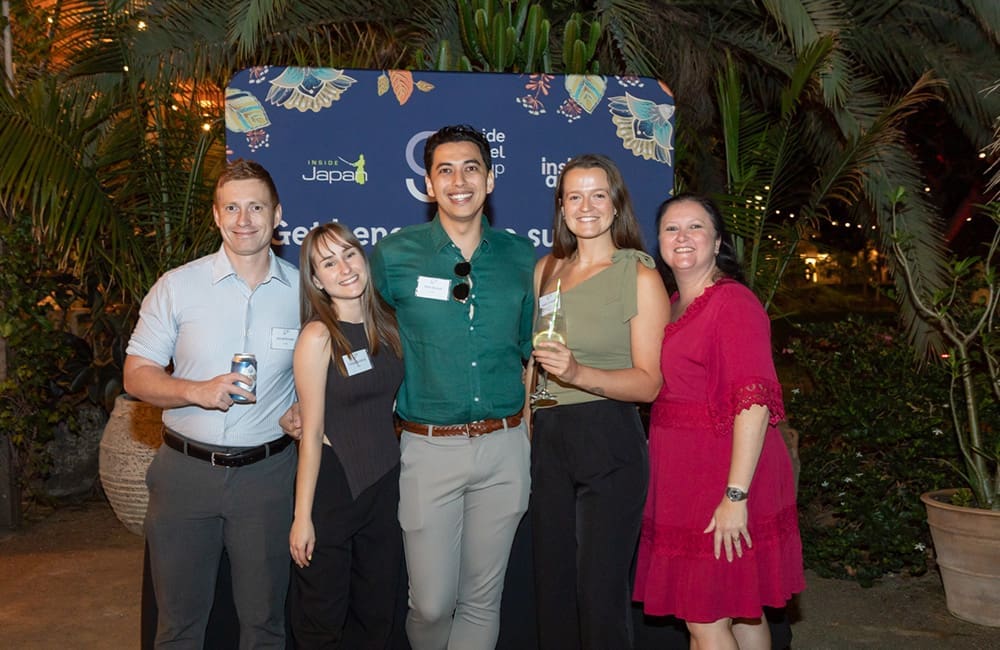 Inside Travel Group team members celebrate 25 years at Brisbane event.
