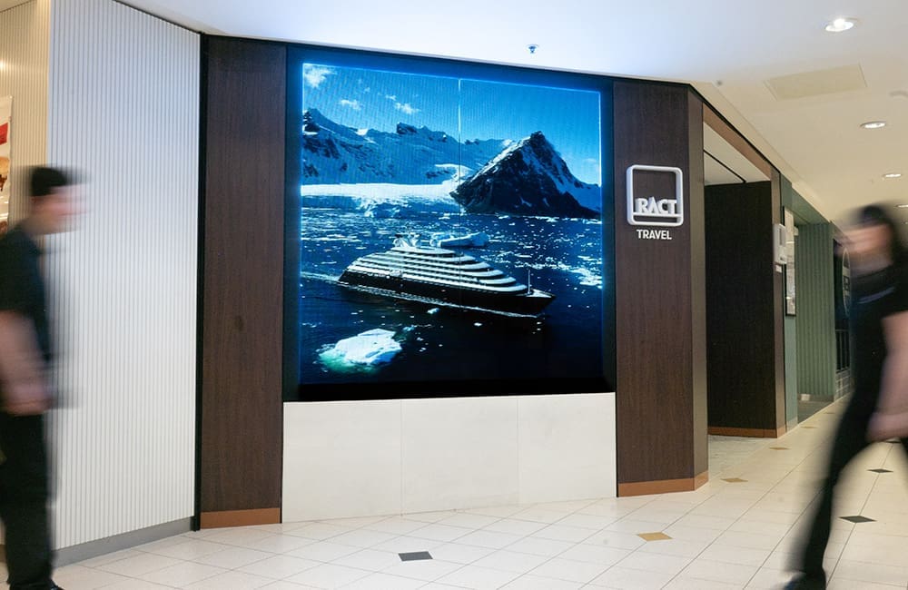 RACT Travel Rosny has Novoglass by Nexnovo transparent panels that turn glass into high-impact digital screens.