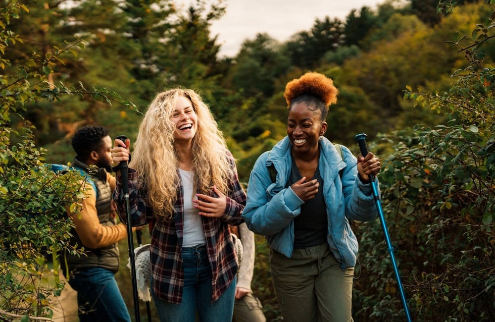 Friends hiking in a forested area –soft-reset trip concept. Image: Shutterstock
