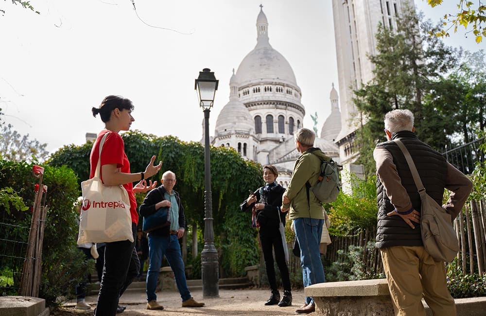 Intrepid Travel trip leader with Short Breaks tour group in Montmartre, Paris, France.