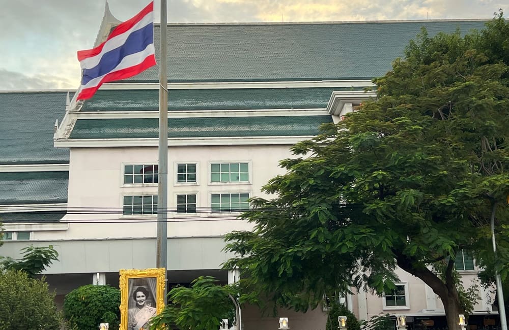 Flags are flying at half-mast at public buildings, such as Thammasat University in Bangkok. Image: retirementbonus/Shutterstock