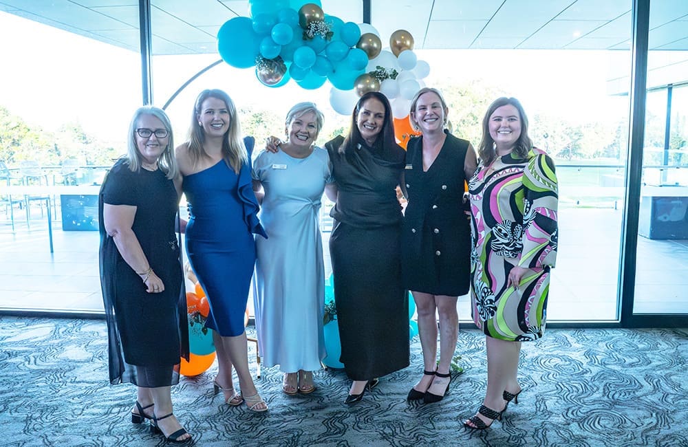 The Melhuish family with key sponsors at the Holiday World 30th anniversary event.