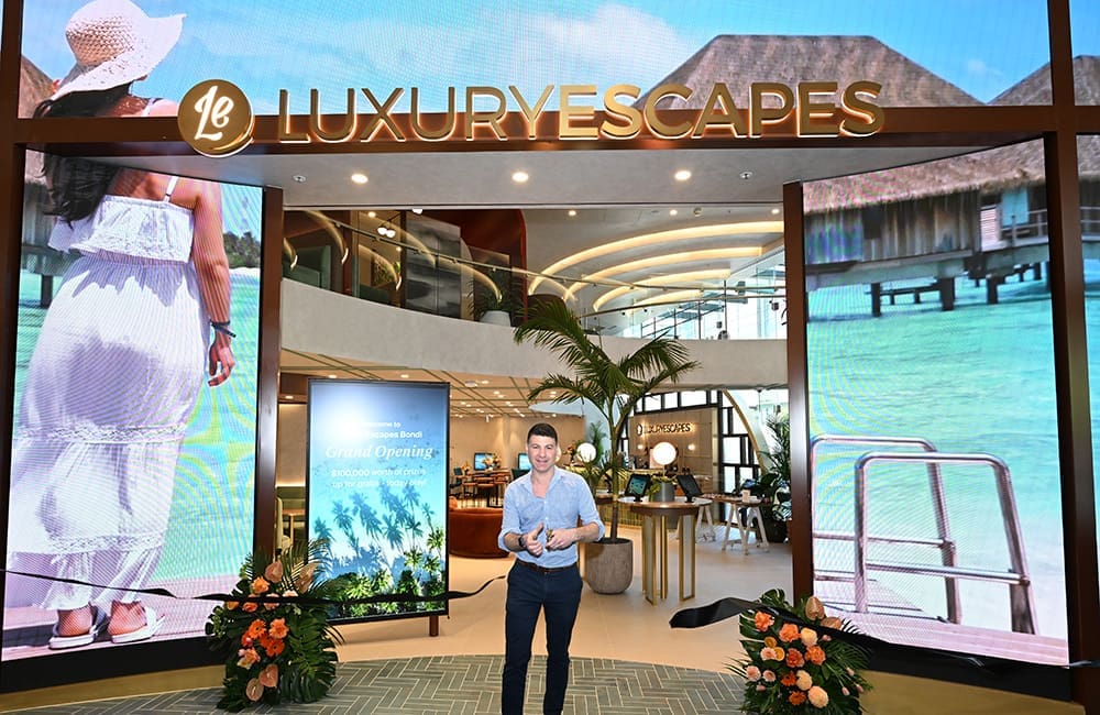 Luxury Escapes Co-Founder & CEO Adam Schwab cuts the ribbon on the new Bondi Junction store.